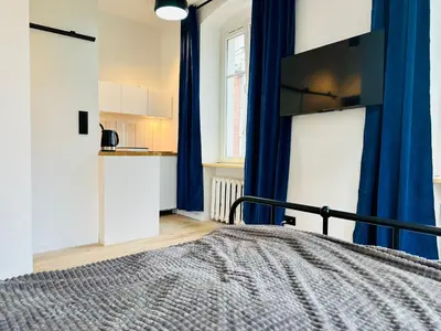 Łóżko lub łóżka w pokoju w obiekcie Apartamenty Maj Sokołowsko