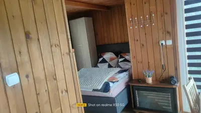 Telewizja i/lub zestaw kina domowego w obiekcie apartament w ogrodzie