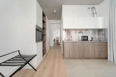Kuchnia lub aneks kuchenny w obiekcie Beautiful White - Beige Apartments in Wrocław by Noclegi Renters