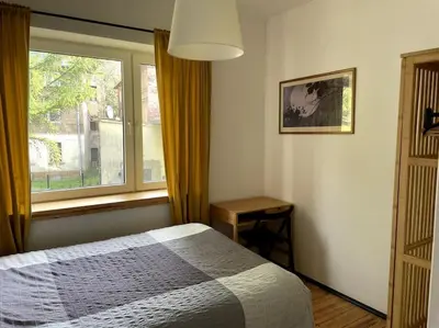 Łóżko lub łóżka w pokoju w obiekcie Pod Modrzewiem