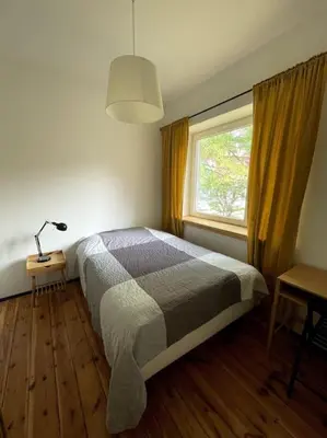 Łóżko lub łóżka w pokoju w obiekcie Pod Modrzewiem