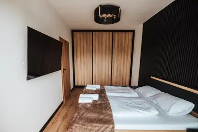 Łóżko lub łóżka w pokoju w obiekcie Apartamenty nad Baryczą