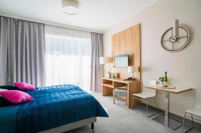Łóżko lub łóżka w pokoju w obiekcie Apartament Folgaria - Aparthotel Panorama Czarna Góra