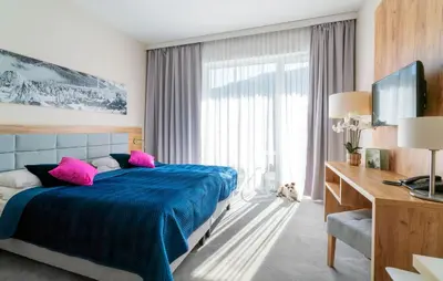 Łóżko lub łóżka w pokoju w obiekcie Apartament Folgaria - Aparthotel Panorama Czarna Góra