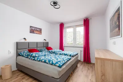 Łóżko lub łóżka w pokoju w obiekcie Apartament GOJA Podzamcze