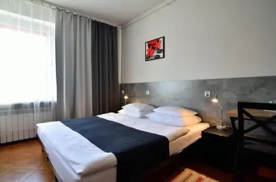 Łóżko lub łóżka w pokoju w obiekcie Hotel Gracja