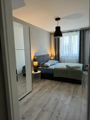 Łóżko lub łóżka w pokoju w obiekcie Brzeska For You II