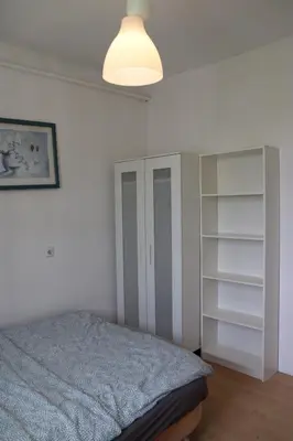Łóżko lub łóżka w pokoju w obiekcie Noclegi - Wyspa Słodowa Rynek Centrum