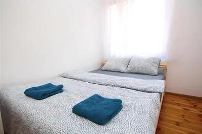 Łóżko lub łóżka w pokoju w obiekcie Noclegi - Wyspa Słodowa Rynek Centrum