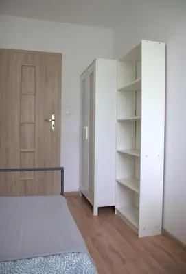 Łóżko lub łóżka w pokoju w obiekcie Noclegi - Wyspa Słodowa Rynek Centrum