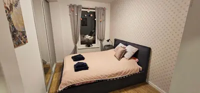 Łóżko lub łóżka w pokoju w obiekcie Apartamenty Natura