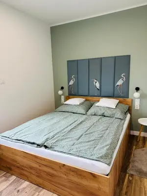 Łóżko lub łóżka w pokoju w obiekcie Apartamenty Dębowa 10