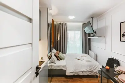 Łóżko lub łóżka w pokoju w obiekcie Stylowe Apartamenty w Centrum