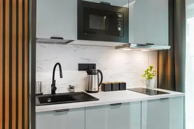 Kuchnia lub aneks kuchenny w obiekcie Stylowe Apartamenty w Centrum
