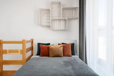 Łóżko lub łóżka w pokoju w obiekcie A.S.HOME Kościuszki 89