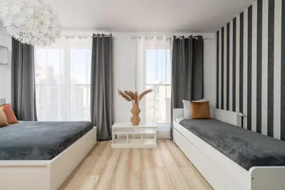 Łóżko lub łóżka w pokoju w obiekcie A.S.HOME Kościuszki 89
