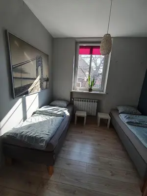 Łóżko lub łóżka w pokoju w obiekcie Apartament Gliwice Centrum plus Parking
