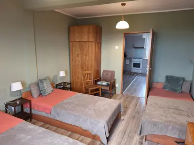 Łóżko lub łóżka w pokoju w obiekcie Apartament POD CHEŁMCEM