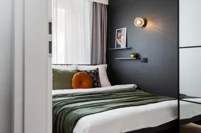 Łóżko lub łóżka w pokoju w obiekcie Kairos Apartments - Chopin II - ścisłe centrum