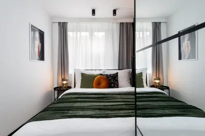 Łóżko lub łóżka w pokoju w obiekcie Kairos Apartments - Chopin II - ścisłe centrum