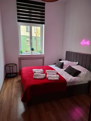 Łóżko lub łóżka w pokoju w obiekcie Apartament Love on 5