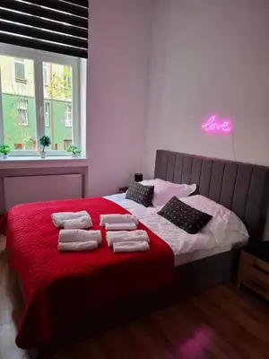 Łóżko lub łóżka w pokoju w obiekcie Apartament Love on 5