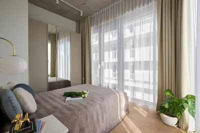Łóżko lub łóżka w pokoju w obiekcie River Premium Apartments