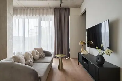 Telewizja i/lub zestaw kina domowego w obiekcie River Premium Apartments