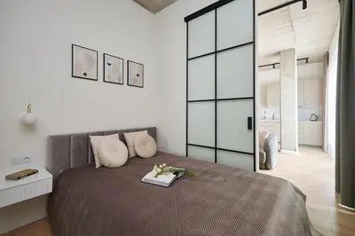 Łóżko lub łóżka w pokoju w obiekcie River Premium Apartments