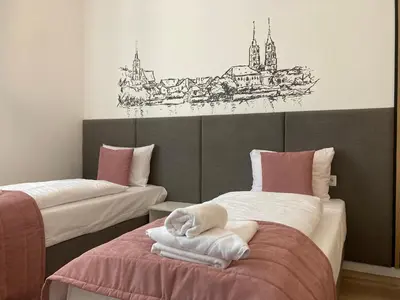 Łóżko lub łóżka w pokoju w obiekcie Aviendo Old Town Apartments