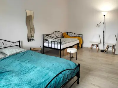 Łóżko lub łóżka w pokoju w obiekcie Apartament Alma
