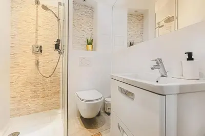 Łazienka w obiekcie Komfort w samym Centrum