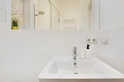 Łazienka w obiekcie Komfort w samym Centrum