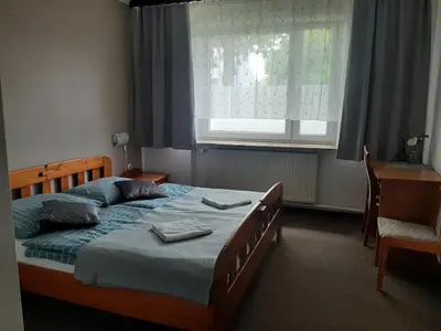Łóżko lub łóżka w pokoju w obiekcie Apart' otel 23