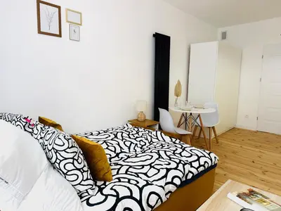 Łóżko lub łóżka w pokoju w obiekcie MagMar Studio Kluczbork