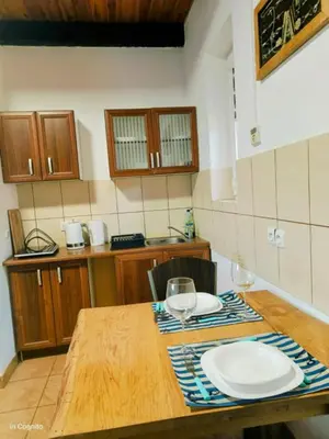 Kuchnia lub aneks kuchenny w obiekcie Domek w Miasteczku Portowym