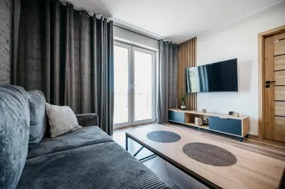 Telewizja i/lub zestaw kina domowego w obiekcie Apartamenty Krakowska 24 z ogródkiem
