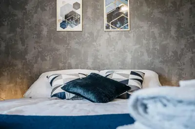 Łóżko lub łóżka w pokoju w obiekcie Apartamenty Krakowska 24 z ogródkiem