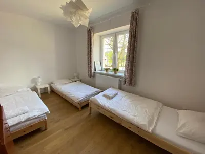 Łóżko lub łóżka w pokoju w obiekcie PrzyLądek Zdrój Bike Apart