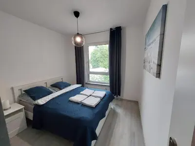 Łóżko lub łóżka w pokoju w obiekcie Apartament Na Grobli , 2-pokoje, Wrocław,blisko Zoo, Rynku, Hydropolis