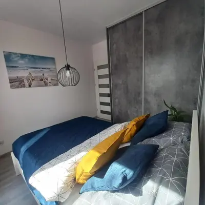 Łóżko lub łóżka w pokoju w obiekcie Apartament Na Grobli , 2-pokoje, Wrocław,blisko Zoo, Rynku, Hydropolis