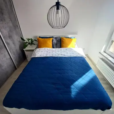 Łóżko lub łóżka w pokoju w obiekcie Apartament Na Grobli , 2-pokoje, Wrocław,blisko Zoo, Rynku, Hydropolis