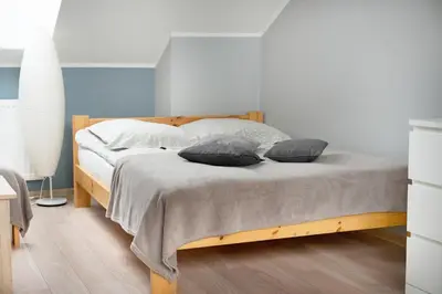 Łóżko lub łóżka w pokoju w obiekcie Apartamenty u Agi