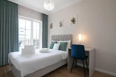 Łóżko lub łóżka w pokoju w obiekcie Apartament2 Bulwar Staromiejski Stare Miasto Centrum