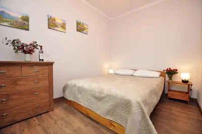 Łóżko lub łóżka w pokoju w obiekcie Słoneczny Apartament przy Rynku