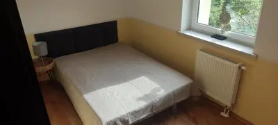 Łóżko lub łóżka w pokoju w obiekcie Apartament na Pilczycach