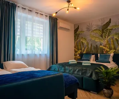 Łóżko lub łóżka w pokoju w obiekcie Apartamenty Cud Miód 2