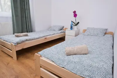 Łóżko lub łóżka w pokoju w obiekcie Apartament Słoneczny 9