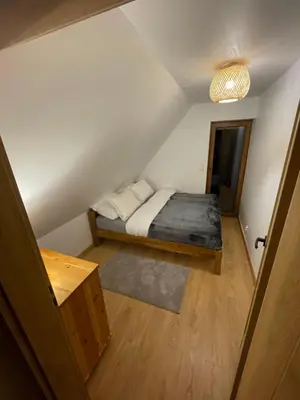 Łóżko lub łóżka w pokoju w obiekcie Lasóweczka