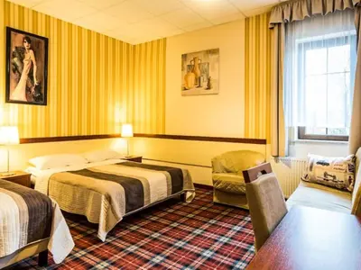 Łóżko lub łóżka w pokoju w obiekcie Hotel Stara Garbarnia